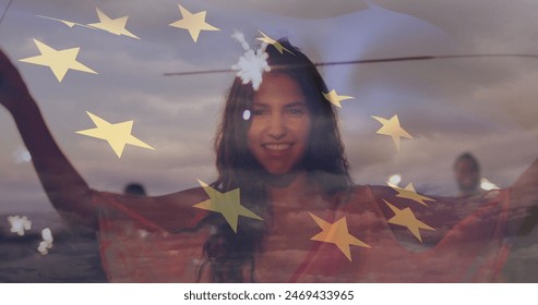 Image of flag of european union over happy biracial woman with sparklers on beach. american patriotism and independence concept digitally generated image. - Powered by Shutterstock