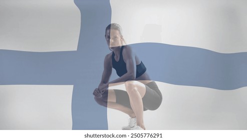 Image of flag of finland over caucasian female athlete. Global sports, competition and patriotism concept digitally generated image. - Powered by Shutterstock