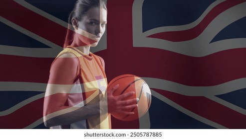 Image of flag of great britain over biracial female basketball player. Global sports, competition and patriotism concept digitally generated image. - Powered by Shutterstock