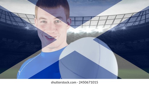 Image of flag of scotland over happy caucasian male rugby player at stadium. sport and social media concept digitally generated image. - Powered by Shutterstock