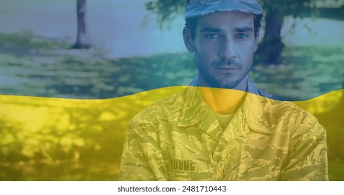 Image of flag of ukraine over biracial male soldier. ukraine crisis and international politics concept digitally generated image. - Powered by Shutterstock