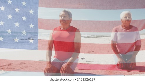 Image of flag of united states of america over senior biracial couple meditating on beach. American patriotism, diversity and tradition concept digitally generated image. - Powered by Shutterstock