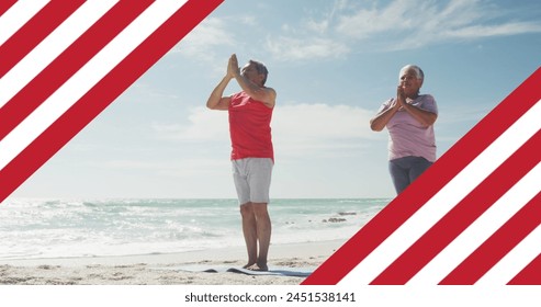 Image of flag of united states of america over senior biracial couple practicing yoga on beach. American patriotism, diversity and tradition concept digitally generated image. - Powered by Shutterstock