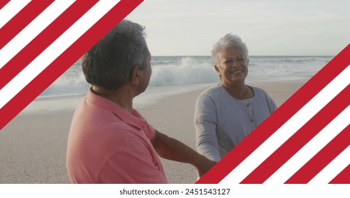 Image of flag of united states of america over senior biracial couple dancing on beach. American patriotism, diversity and tradition concept digitally generated image. - Powered by Shutterstock