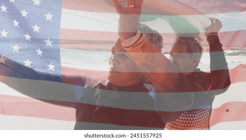 Image of flag of united states of america over senior biracial couple with surfboard on beach. American patriotism, diversity and tradition concept digitally generated image. - Powered by Shutterstock