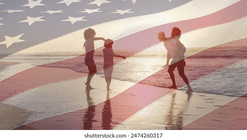 Image of flag of united states of america over african american family on beach. american history, patriotism and independence concept digitally generated image. - Powered by Shutterstock