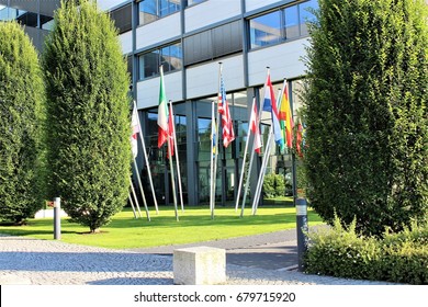 An image of flags infront of a building