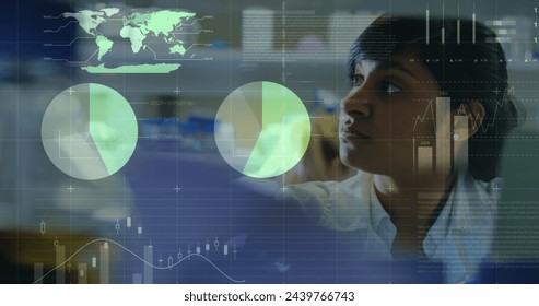 Image of floating diagrams, circles, world map and data processing over biracial female doctor examining. Medical staff during Covid-19 coronavirus pandemic concept.