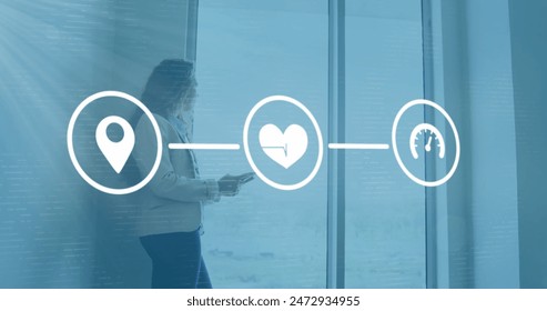 Image of flowchart, biracial woman using digital tablet and looking through glass window. Digital composite, multiple exposure, communication, direction, business and technology concept. - Powered by Shutterstock