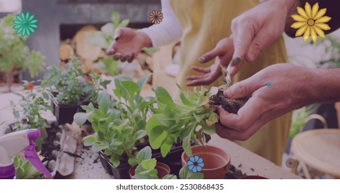 Image of flowers over happy diverse couple planting plants together. Relationship, spring, gardening and lifestyle concept digitally generated image. - Powered by Shutterstock