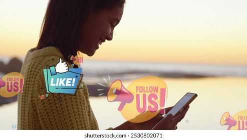 Image of follow us over midsection of smiling biracial woman using smartphone at beach. global connections, social media, technology and digital interface concept digitally generated image. - Powered by Shutterstock