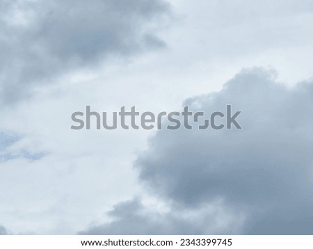 The image of the formidable storm clouds in close-up is sight that commands attention and evokes sense of awe and trepidation. Сlouds loom large, dominating frame with their dark and ominous presence.