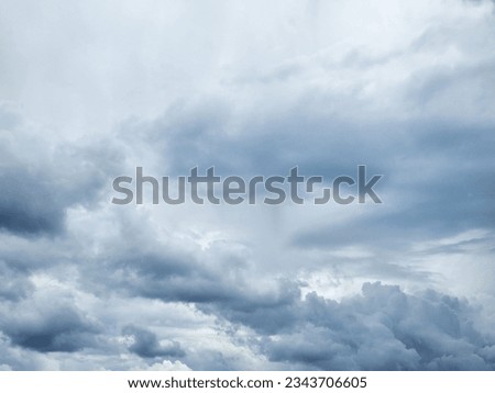 The image of the formidable storm clouds in close-up is sight that commands attention and evokes sense of awe and trepidation. Сlouds loom large, dominating frame with their dark and ominous presence.