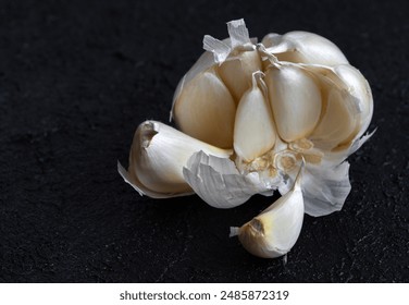 Image of fresh garlic and small garlic cloves inside garlic. - Powered by Shutterstock