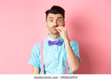 Image Of Funny Guy With Moustache And Bow-tie Showing Chefs Kiss Gesture, Compliment Excellent Product, Praising Food, Standing Over Pink Background