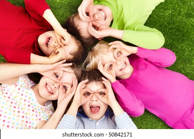 Image of funny kids playing on the grass