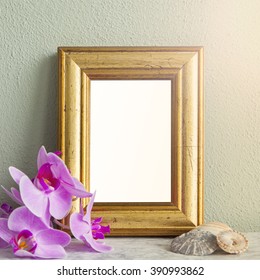 Image Of A Gilded Frame Mockup Scene, With Orchids And Sea Shells. 