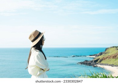 image of a girl and a clear blue beach - Shutterstock ID 2330302847