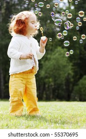The image of the girl puts the bubbles in the park