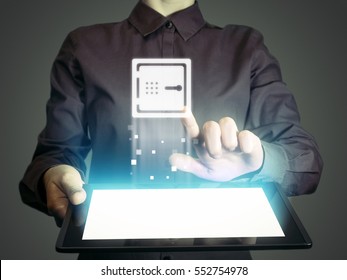 Image Of A Girl With A Tablet In Hands. She Touches Safe Icon. Concept Of Online Banking, Online Security, Protection Digital Safe Money