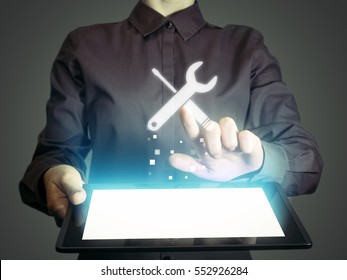 Image of a girl with tablet in her hands. She presses technical support button on virtual screen. The concept of customer support, interface customization, etc.