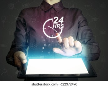 Image of a girl with tablet pc in her hands and 24-hour support service icon. Concept of 24-hour support.