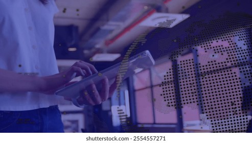 Image of globe and data processing over caucasian businesswoman using tablet in office. Global finance, business, connections, computing and data processing concept digitally generated image. - Powered by Shutterstock