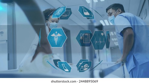 Image of globe made of hexagons with scientific icons over diverse doctors running with bed. Science, health and medicine concept digitally generated image. - Powered by Shutterstock