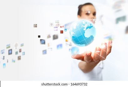 Image of globe on palm of businesswoman. Media technologies - Shutterstock ID 164693732