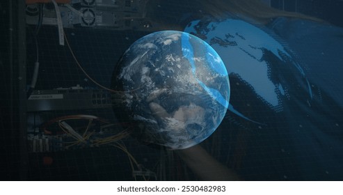 Image of globe rotating over integrated circuit on black background. Global network, data processing, finance and technology concept digitally generated image.