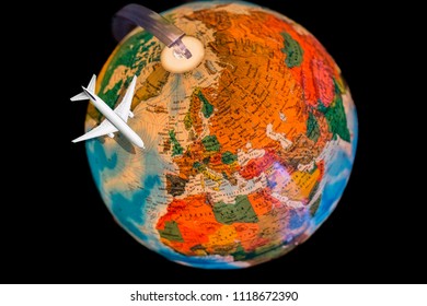 image of globe shot on northern hemisphere with europe asia and part of africa with traveling airplane on black background