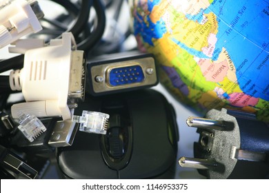 Image of globe with three computer mice. Computer hardware cords.