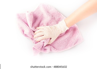 The image of a gloved hand cleaning with a microfiber towel