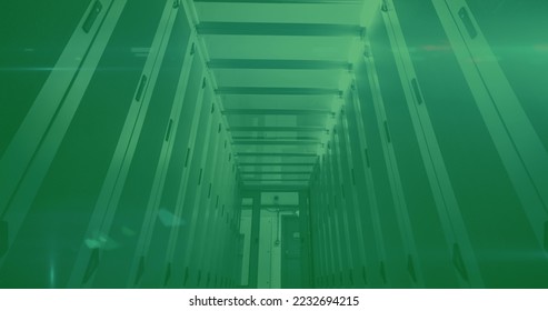 Image of glowing green QR code with neon elements and computer servers on green background. Global online security data technology concept digitally generated image.