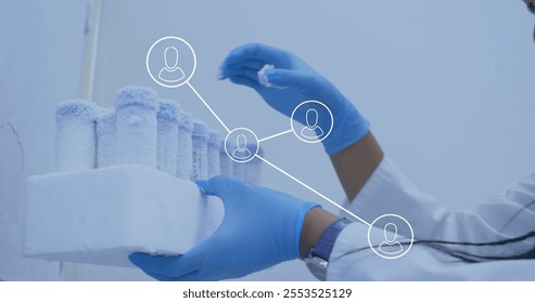 Image of glowing light trails over biracial female scientist in laboratory. Global science, connections, computing and data processing concept digitally generated image. - Powered by Shutterstock