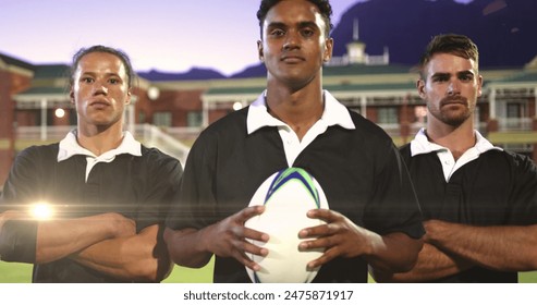 Image of glowing lights over diverse rugby players in sports stadium. rugby, teamwork, sports and competition concept digitally generated image. - Powered by Shutterstock