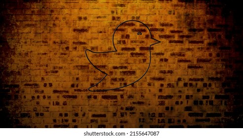 Image of glowing neon bird icon on brick wall. social media and communication concept digitally generated image. - Powered by Shutterstock