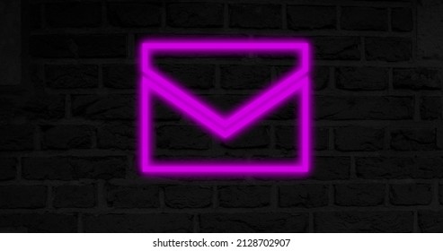 Image of glowing neon envelope icon on brick wall. social media and communication concept digitally generated image. - Powered by Shutterstock