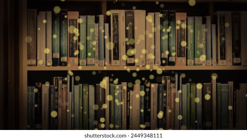 Image of glowing spots over books on shelf. international literacy day and reading concept digitally generated image. - Powered by Shutterstock