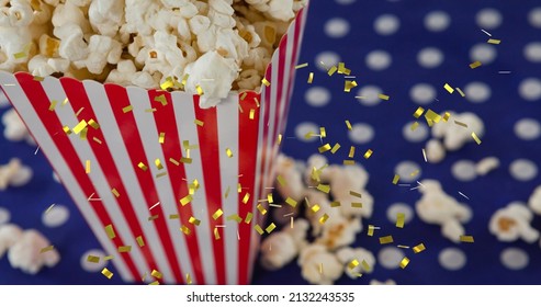 Image of golden confetti over box of popcorn. popcorn day and celebration concept digitally generated image. - Powered by Shutterstock