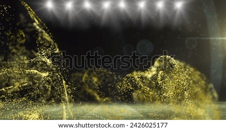 Image of golden particles moving over floodlit room. sport, competition, communication and technology concept, digitally generated image.