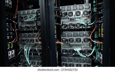 Image of GPU server racks with a liquid-cooled supercomputer system. These types of high-performance computing (HPC) systems are used for AI research.