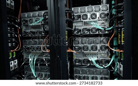 Image of GPU server racks with a liquid-cooled supercomputer system. These types of high-performance computing (HPC) systems are used for AI research.