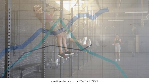 Image of graph processing data over diverse group cross training on pull up bars and rope at gym. Fitness, exercise, strength, data, digital interface and technology digitally generated image.