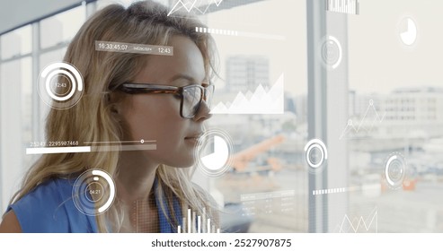 Image of graphs, changing numbers, loading circles and bars, thoughtful caucasian woman. Digital composite, multiple exposure, report, growth, progress and business concept. - Powered by Shutterstock