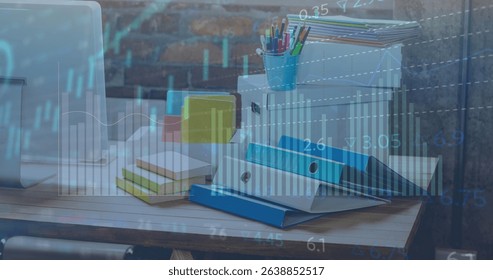 Image of graphs and charts processing data over stationery and computer on office desk. Global communication, business, data and digital interface concept digitally generated image.
