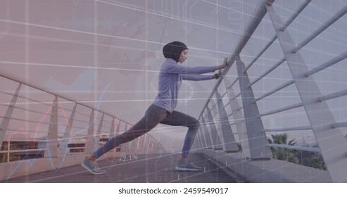 Image of graphs and circle with grid over biracial woman in hijab stretching on footbridge. Digital composite, multiple exposure, report, business, technology, data, exercise, fitness concept. - Powered by Shutterstock