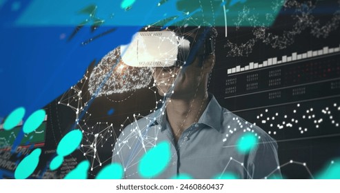 Image of graphs, connections and data over caucasian man in vr headset. Data processing, connections, finance and technology concept digitally generated image.