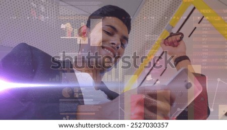 Image of graphs and data over biracial man using smartphone in bus. economy, finance, communication and technology concept digitally generated image,