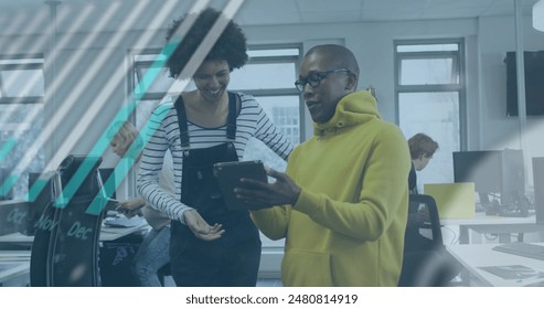 Image of graphs, globe and computer language over diverse coworkers discussing over tablet. Digital composite, office, report, global business, globalization, teamwork, coding and technology. - Powered by Shutterstock